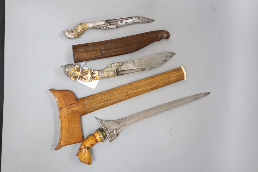 Two Ceylonese knives Pia Kaetta, both with ivory grips and silver mounts and a Malayan dagger kris (3)